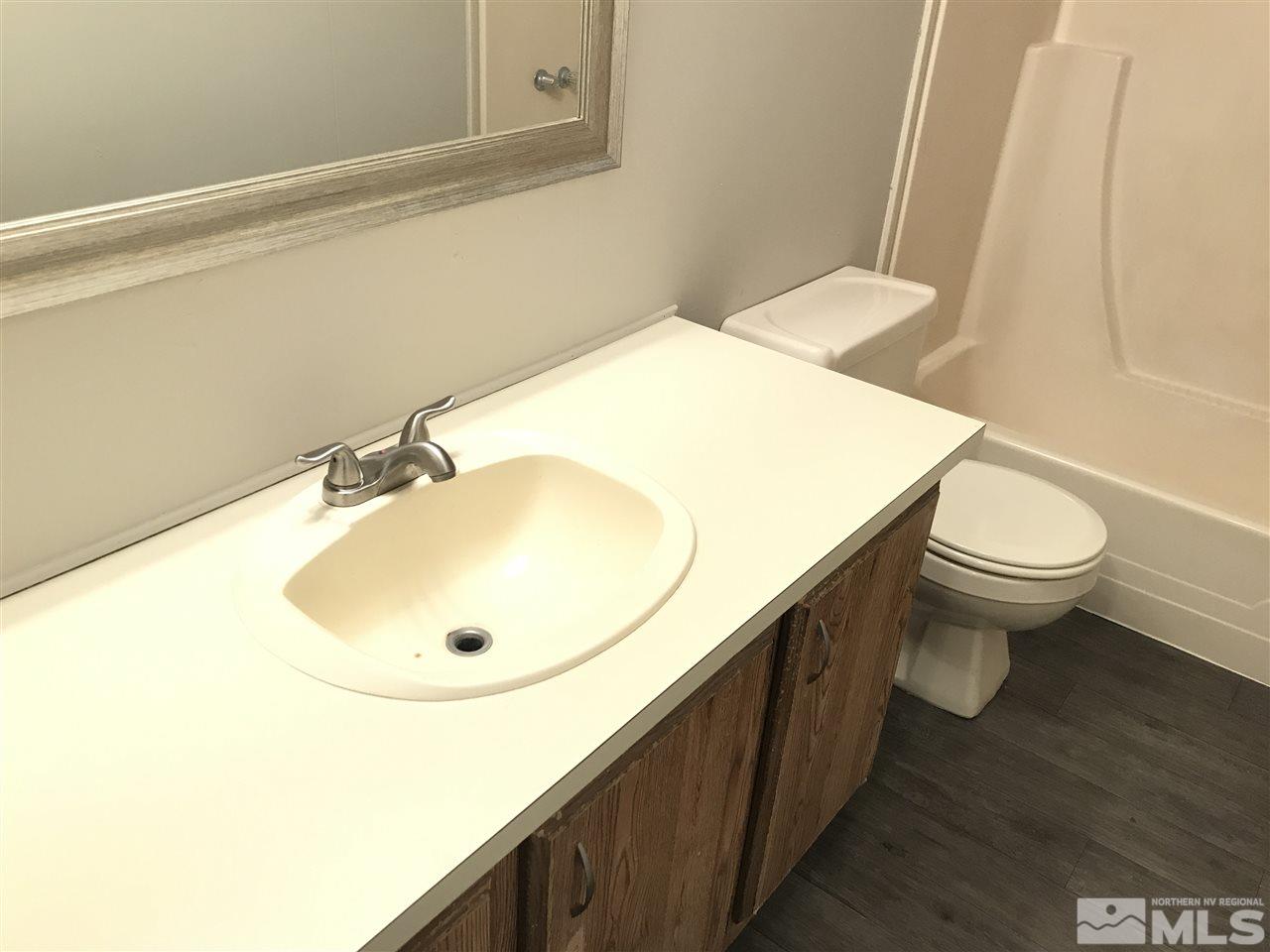 17400 Whippoorwill Lane Reno, NV 89508 - Photo 13 of 18 a bathroom with a sink and a toilet