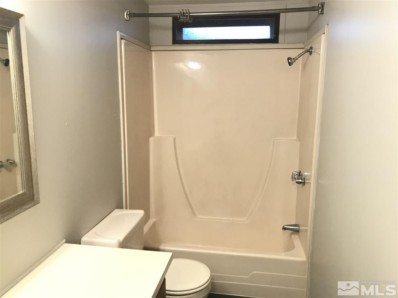17400 Whippoorwill Lane Reno, NV 89508 - Photo 14 of 18 a bathroom with a bathtub and a toilet