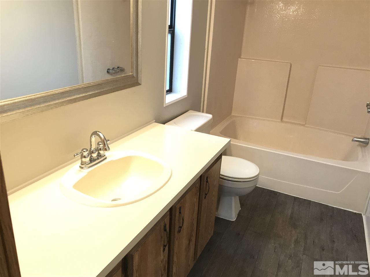 17400 Whippoorwill Lane Reno, NV 89508 - Photo 17 of 18 a bathroom with a sink and a toilet