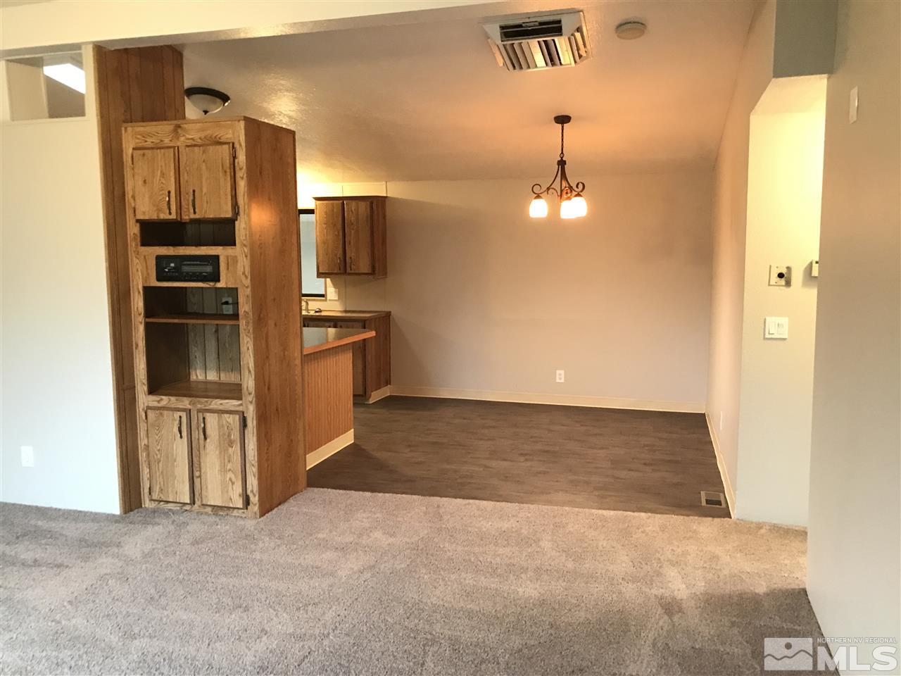 17400 Whippoorwill Lane Reno, NV 89508 - Photo 3 of 18 a view of a kitchen with a sink and a refrigerator