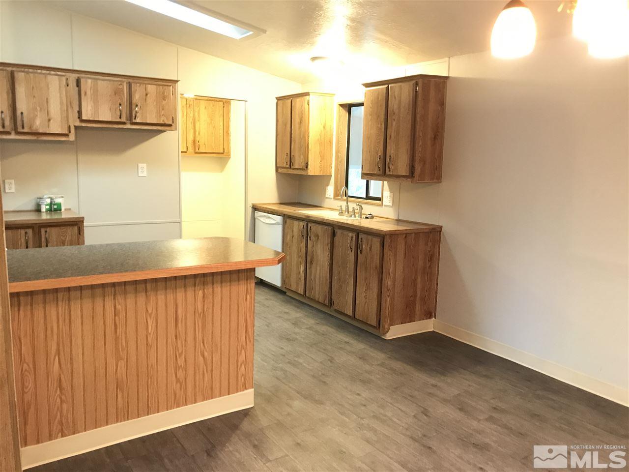 17400 Whippoorwill Lane Reno, NV 89508 - Photo 4 of 18 a kitchen with stainless steel appliances a refrigerator and cabinets