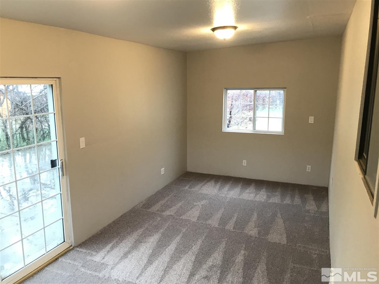 17400 Whippoorwill Lane Reno, NV 89508 - Photo 7 of 18 a view of an empty room with a window