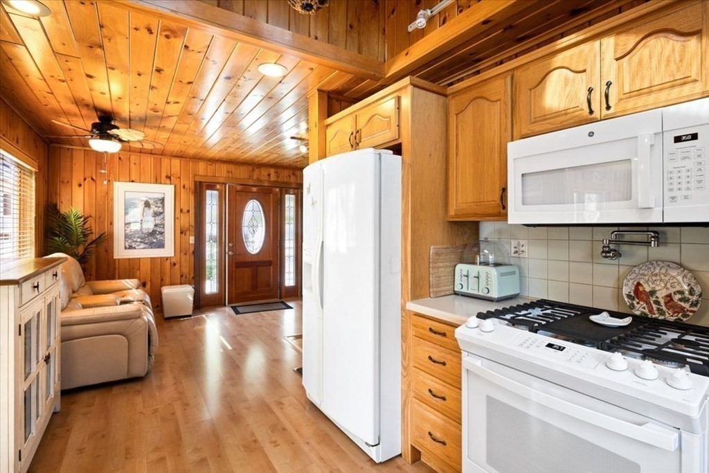 7 Glendale Road Wareham, MA 02558 - Photo 7 of 33 a view of a kitchen with furniture and wooden floor
