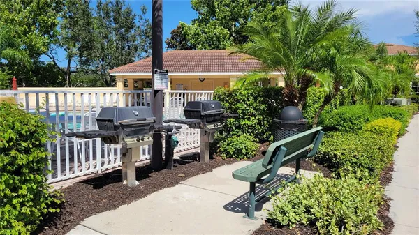 a view of backyard with deck and garden