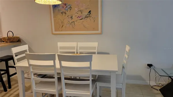 a room with a table and chairs