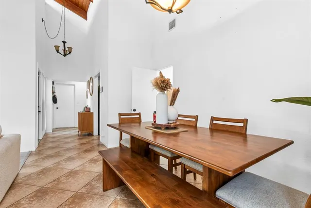 a view of a room with furniture and wooden floor
