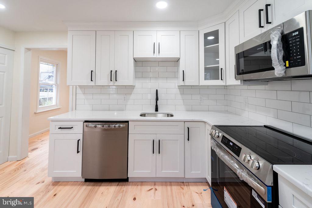 20 West Raspberry Street Bethlehem, PA 18018 - Photo 15 of 32 a kitchen with stainless steel appliances granite countertop a sink stove and microwave