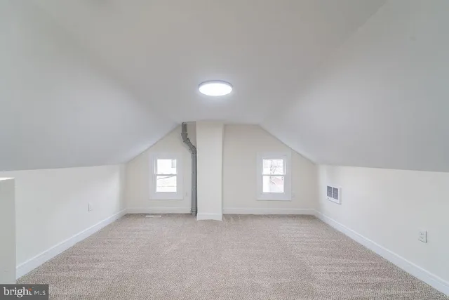 a view of empty room with windows