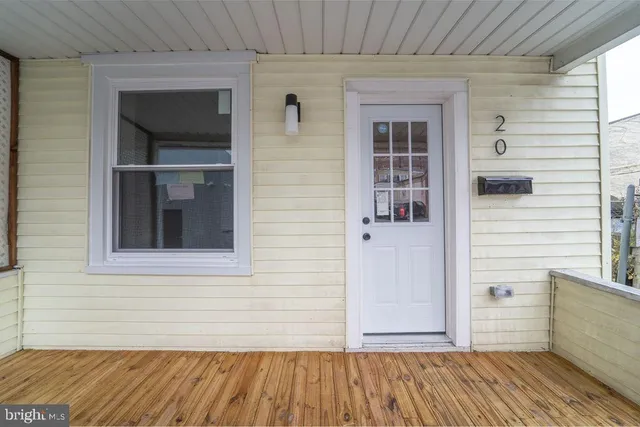 a view of a balcony with wooden floor