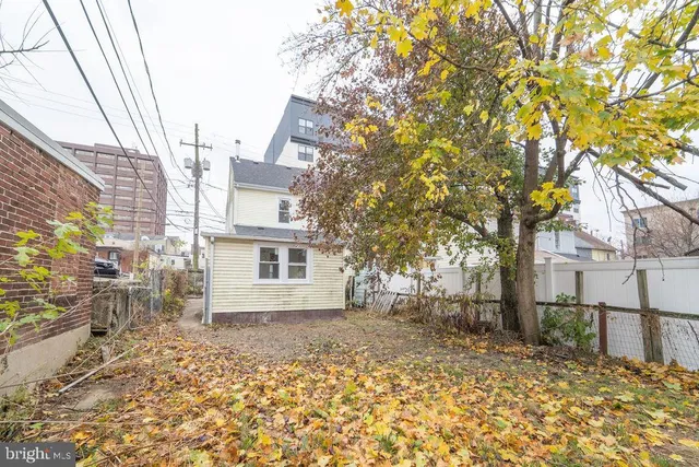 a view of a house with a tree