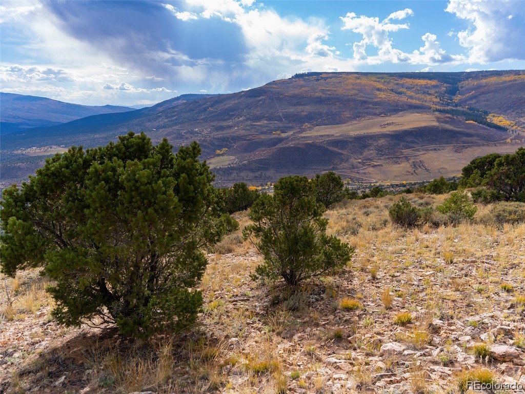 0 State Highway McCoy, CO 80463 - Photo 17 of 29 a view of a backyard of a house with a mountain