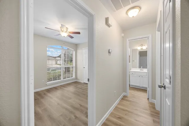 a view of an empty room with a bathroom