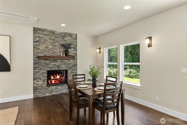 a dining room with furniture and a fireplace