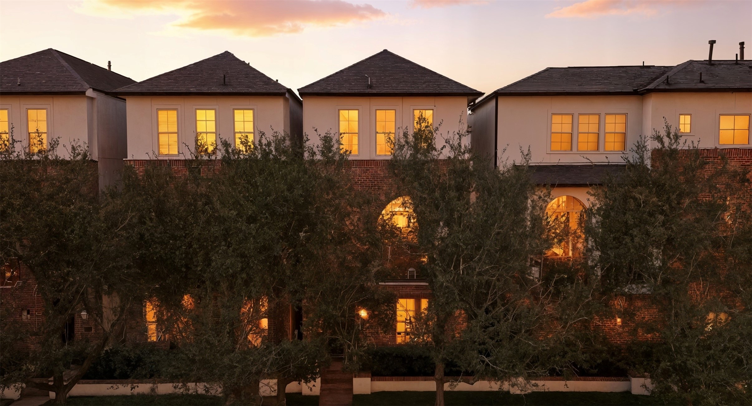 a front view of house with green space