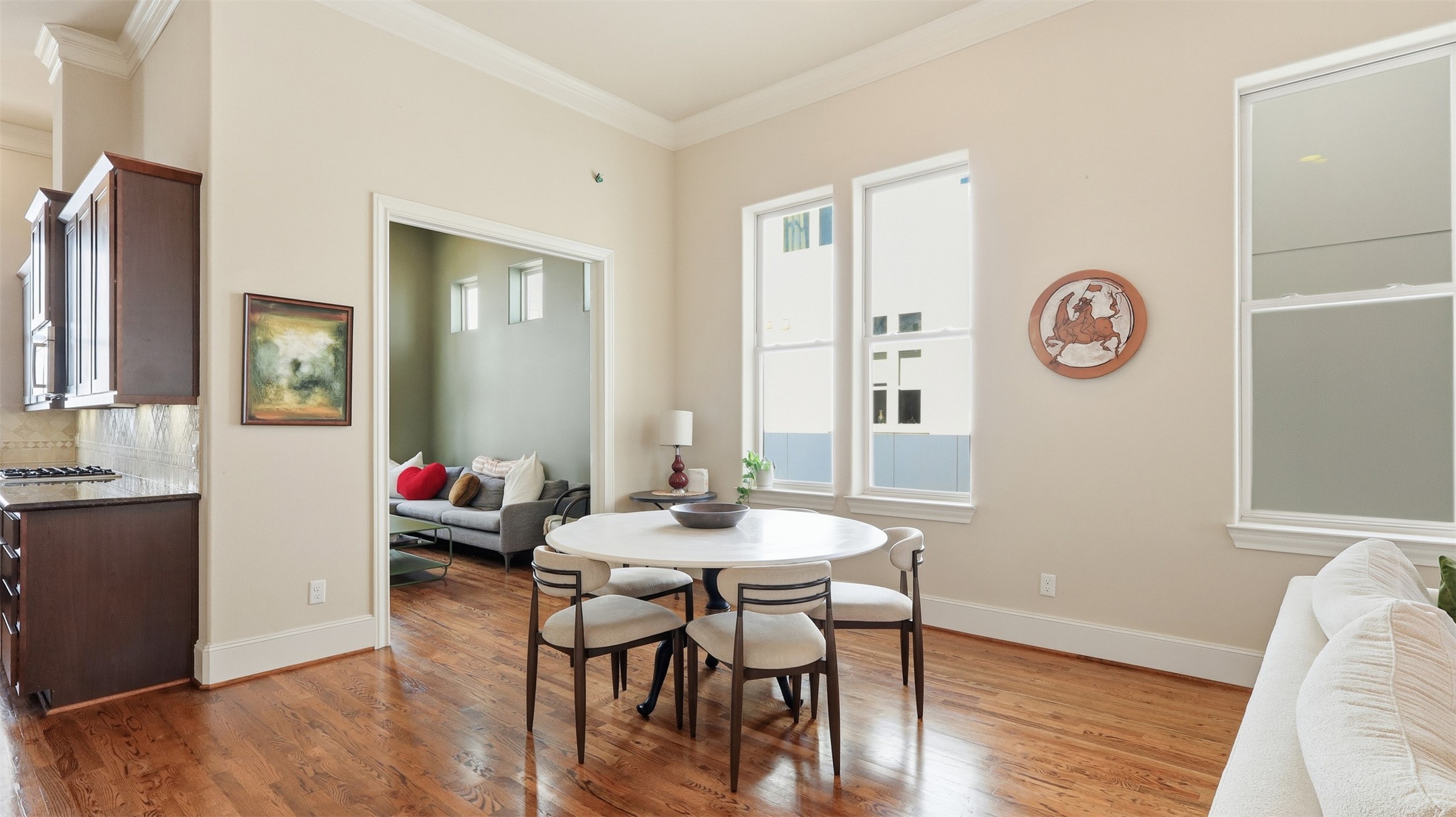 704 Paige Street Houston, TX 77003 - Photo 12 of 41 a view of a dining room with furniture and wooden floor