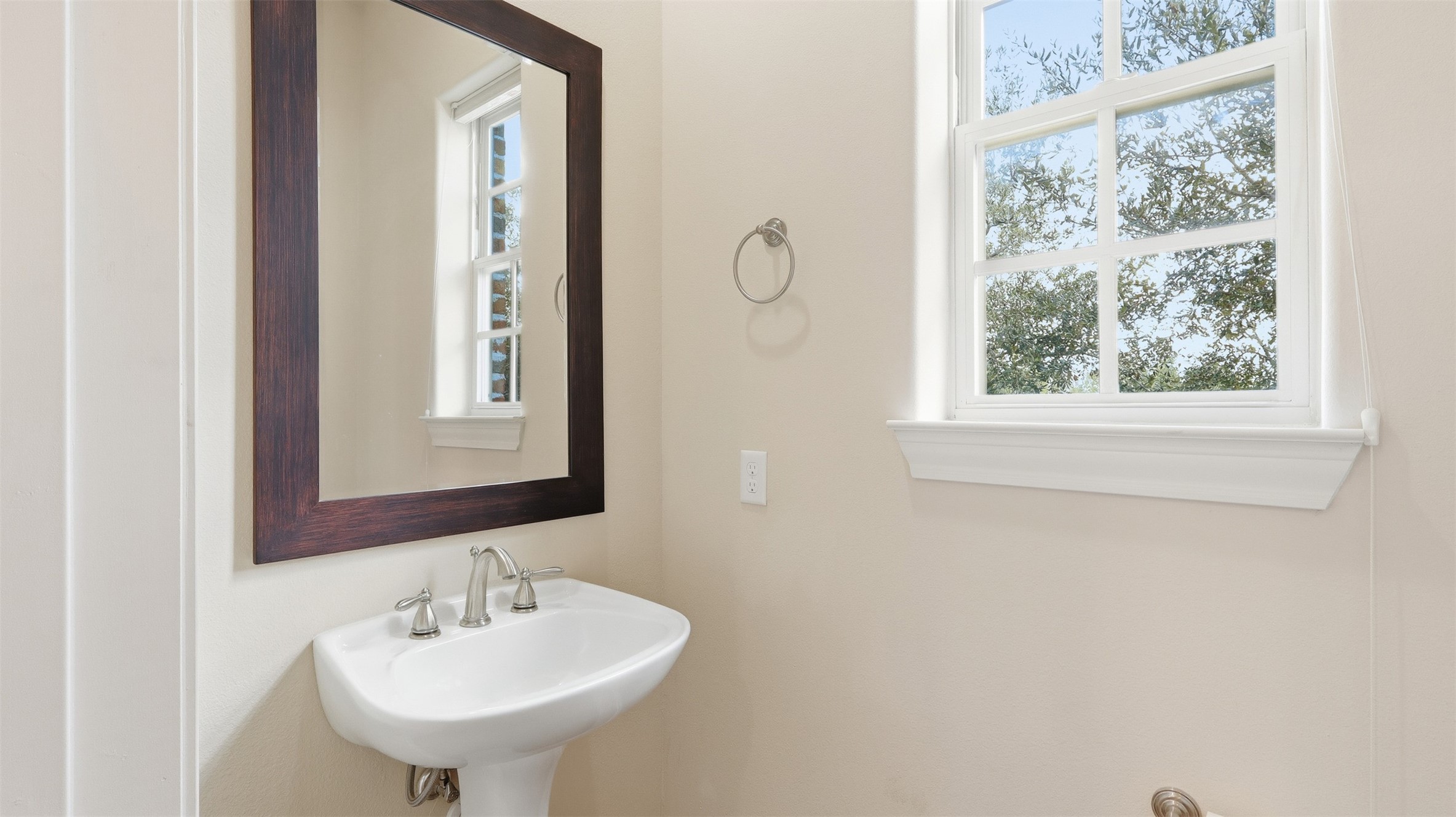 704 Paige Street Houston, TX 77003 - Photo 20 of 41 a bathroom with a sink and a mirror