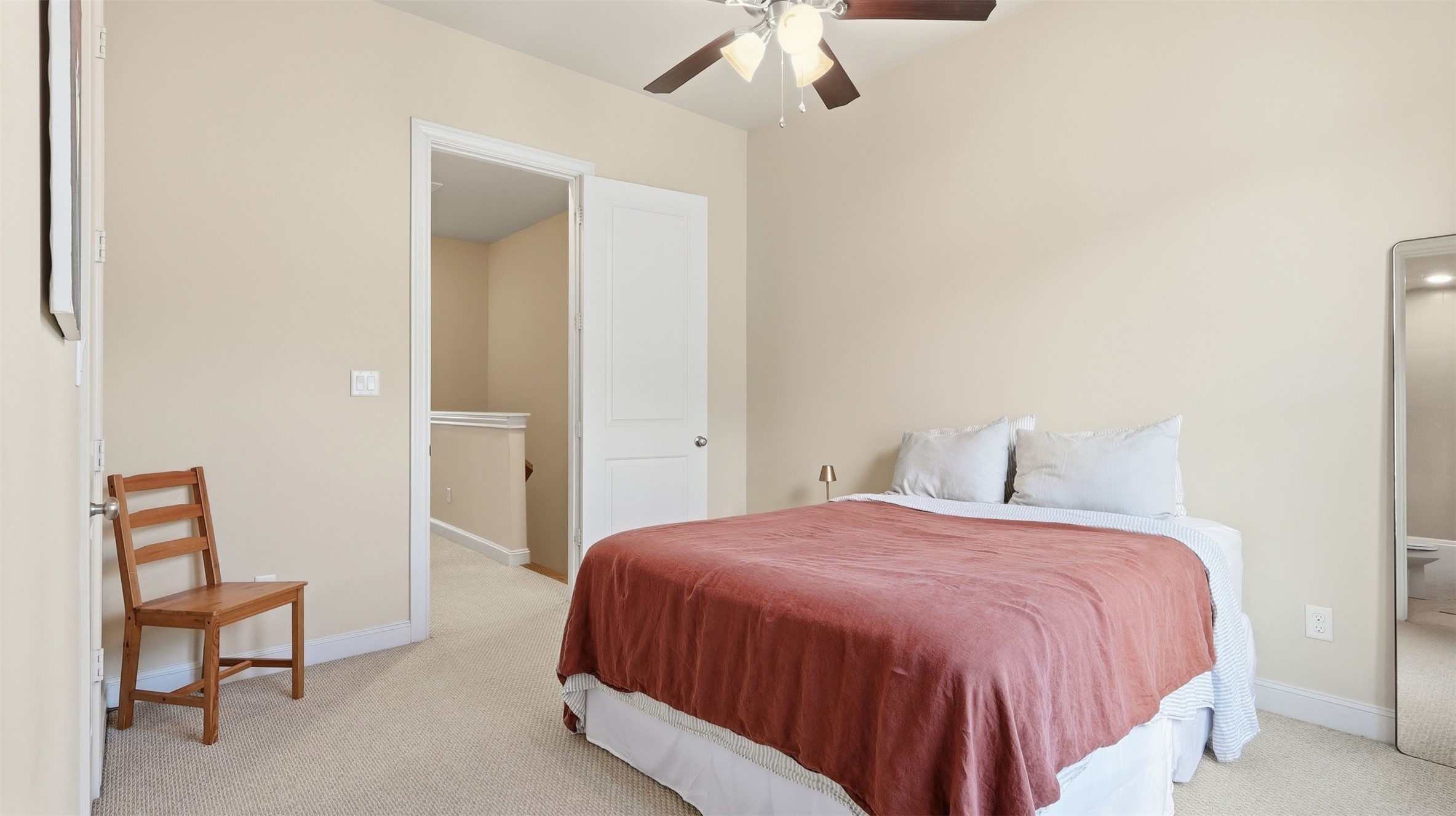 704 Paige Street Houston, TX 77003 - Photo 23 of 41 a bedroom with a bed and a chair