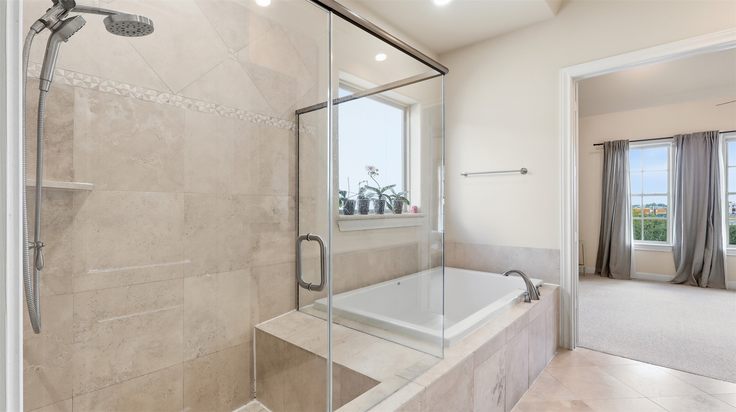 704 Paige Street Houston, TX 77003 - Photo 30 of 41 a bathroom with a bathtub and a shower