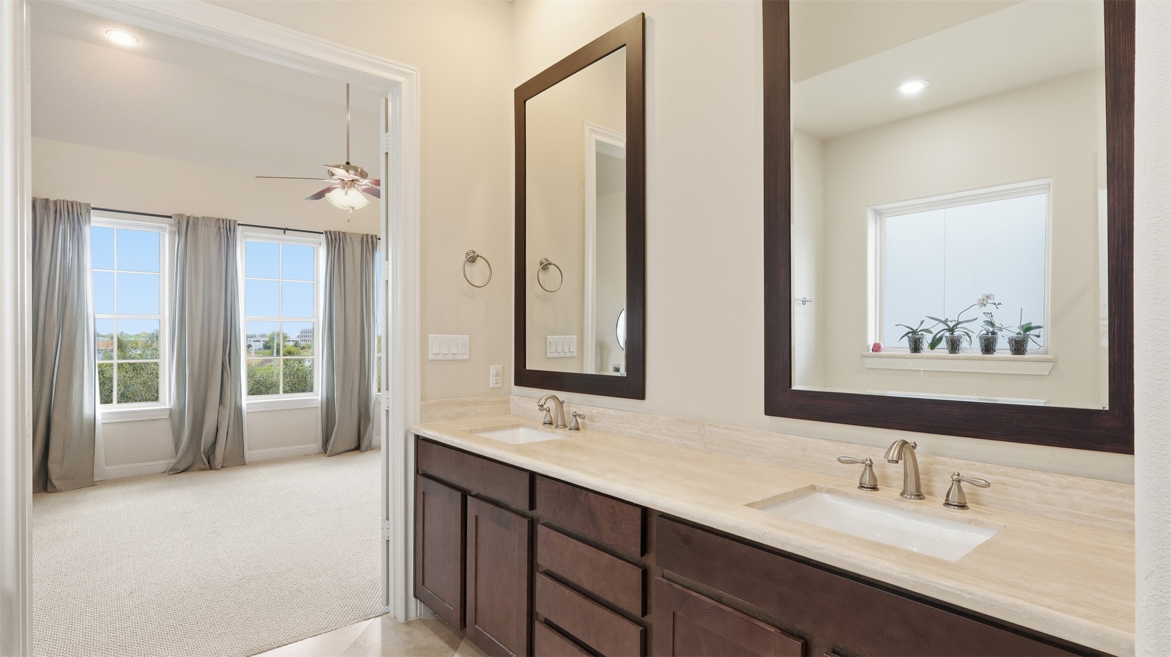 704 Paige Street Houston, TX 77003 - Photo 31 of 41 a bathroom with double vanity sinks a large mirror and a shower