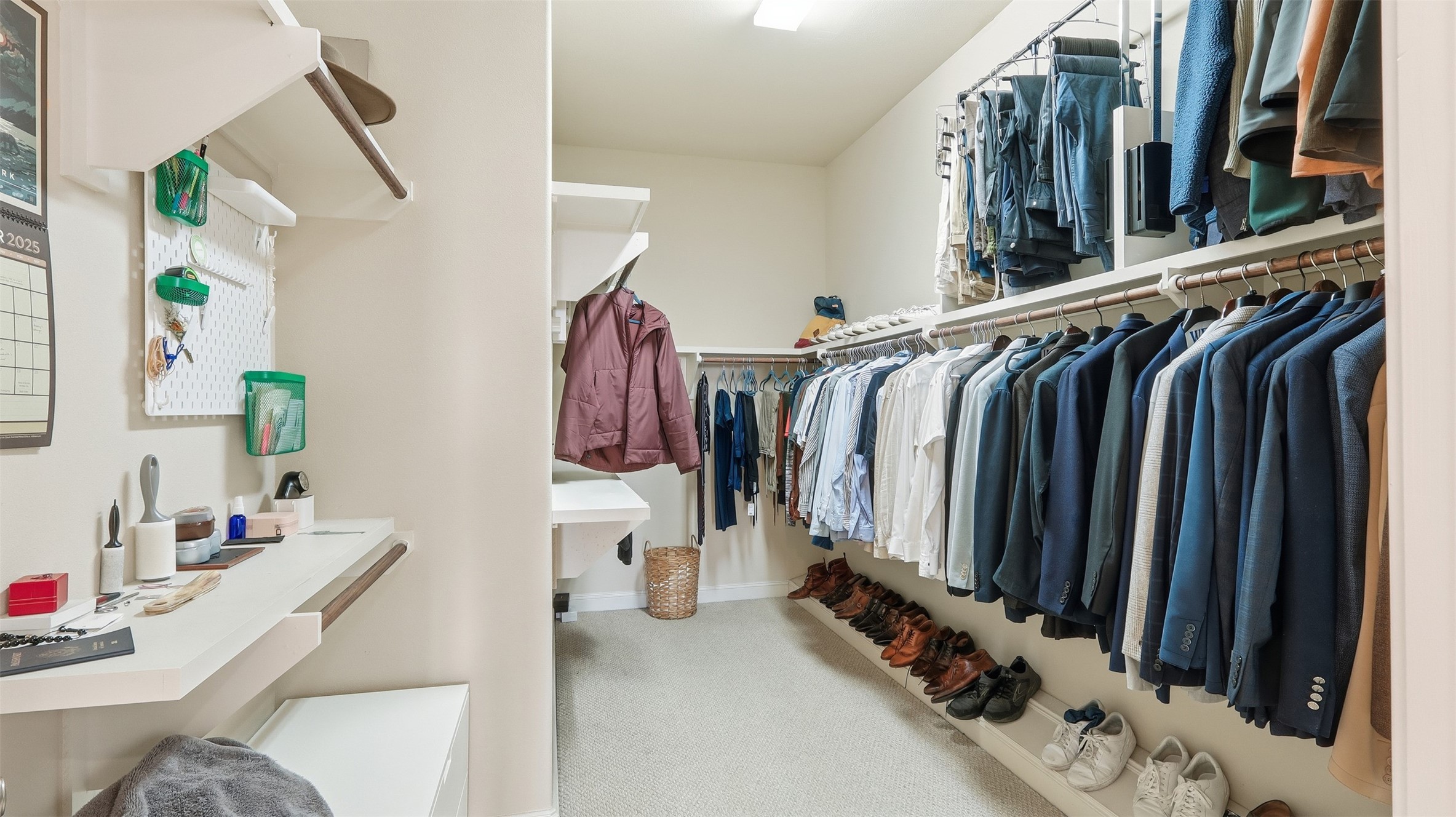 704 Paige Street Houston, TX 77003 - Photo 32 of 41 a view of walk in closet with clothes and shoes