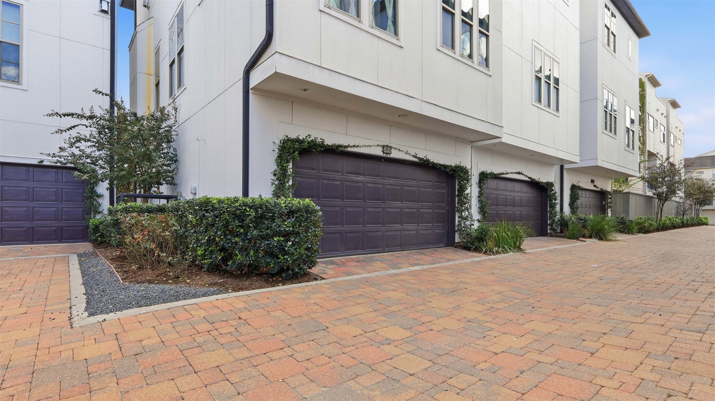 704 Paige Street Houston, TX 77003 - Photo 33 of 41 a couple of potted plants in front of a building