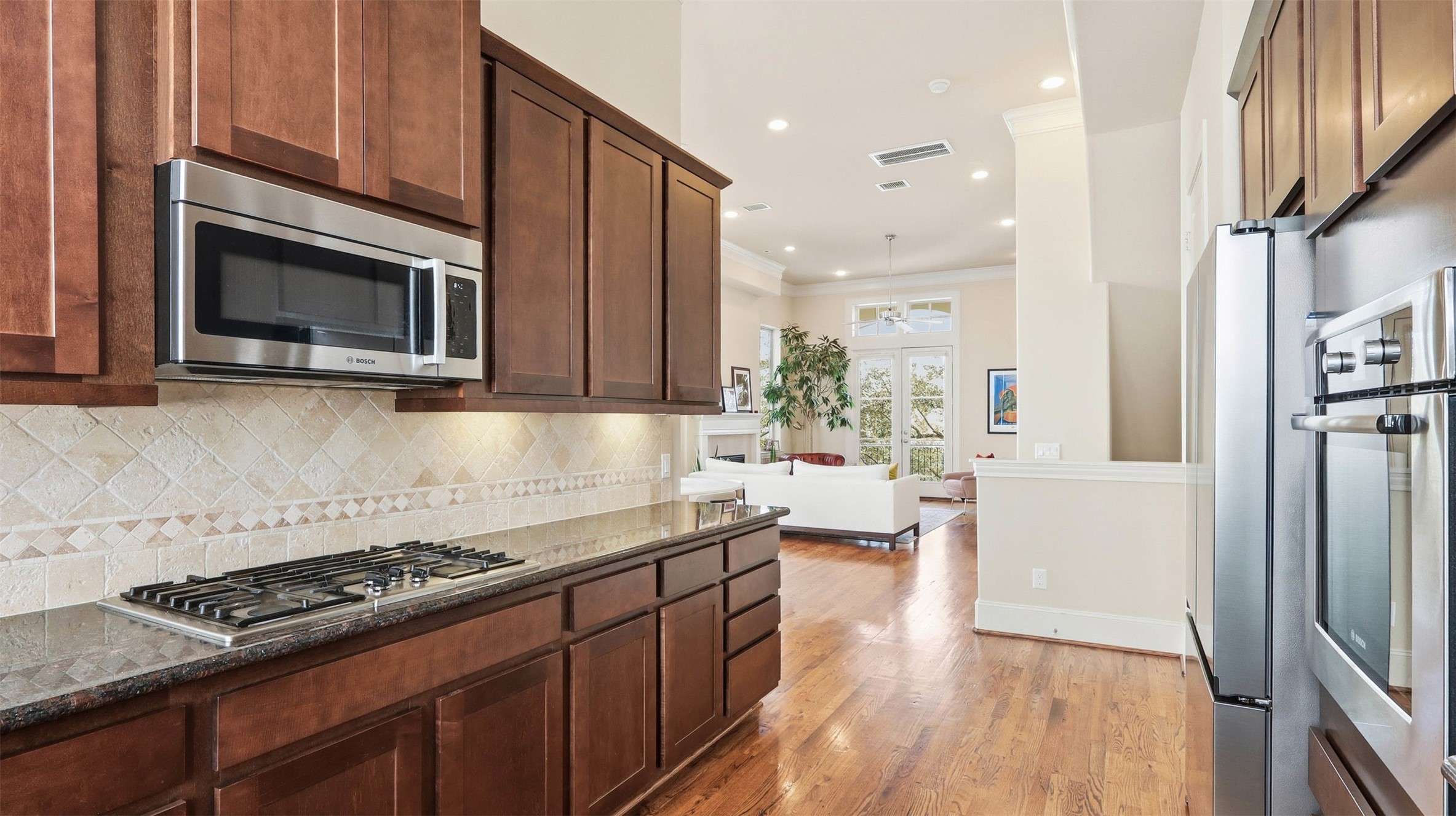 704 Paige Street Houston, TX 77003 - Photo 10 of 41 a kitchen with stainless steel appliances granite countertop a stove a sink and a refrigerator