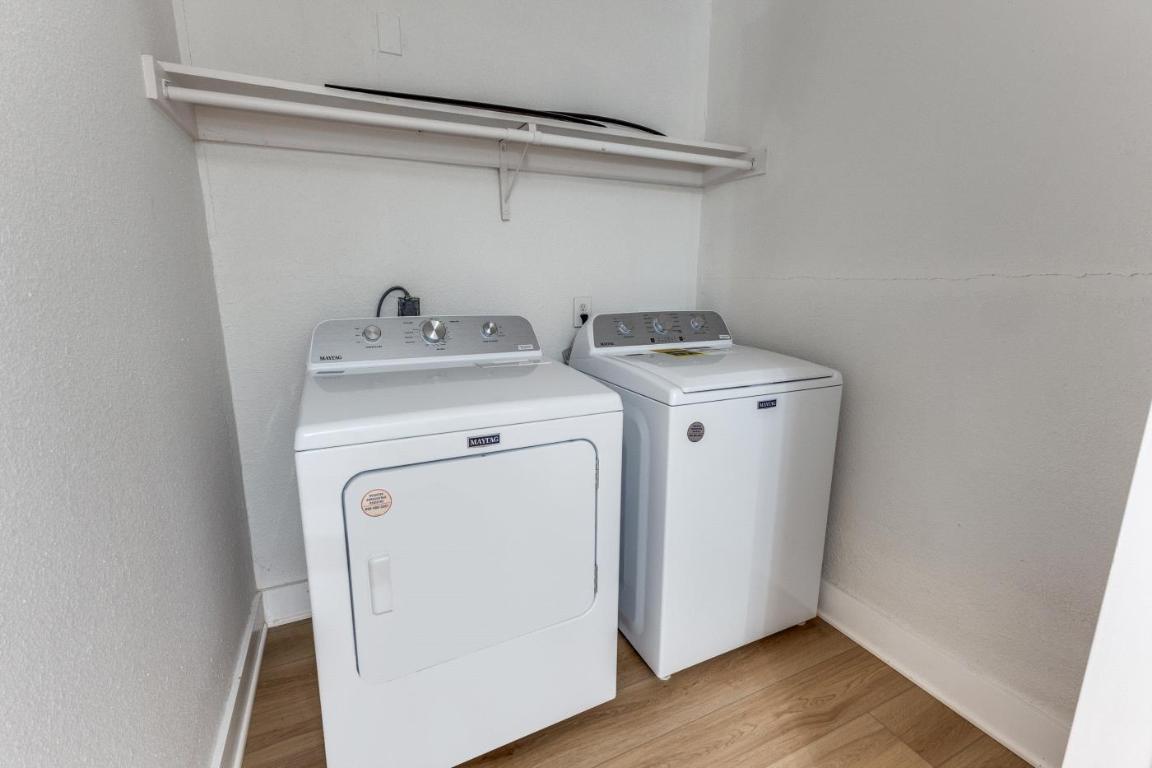 5617 Tallow Tree Drive Austin, TX 78744 - Photo 23 of 25 a utility room with dryer and washer