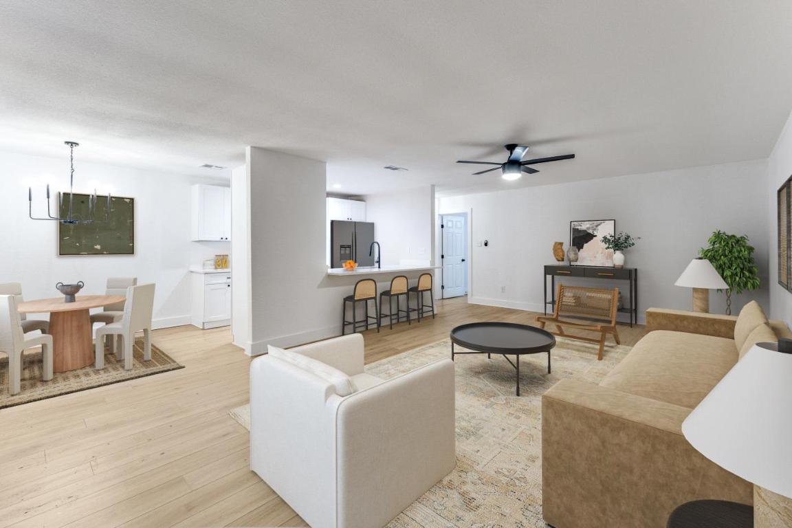 5617 Tallow Tree Drive Austin, TX 78744 - Photo 4 of 25 a living room with furniture and a flat screen tv