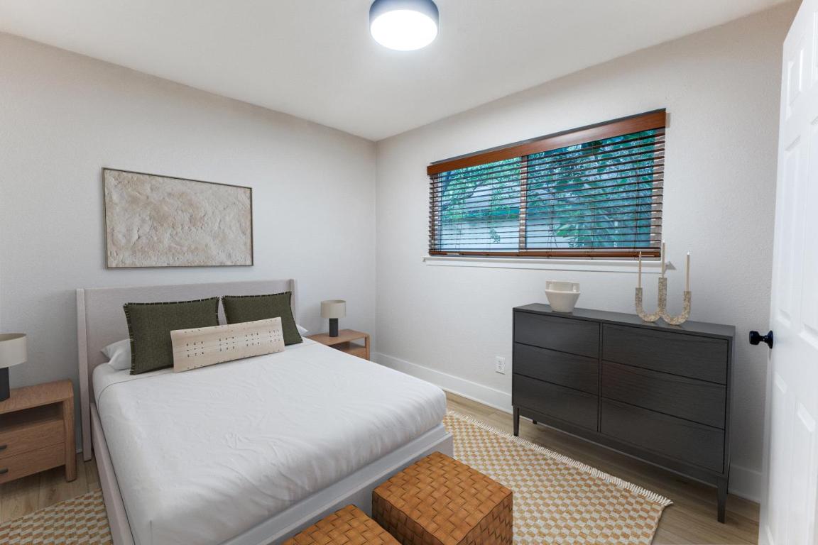 5617 Tallow Tree Drive Austin, TX 78744 - Photo 9 of 25 a bedroom with a bed and a window
