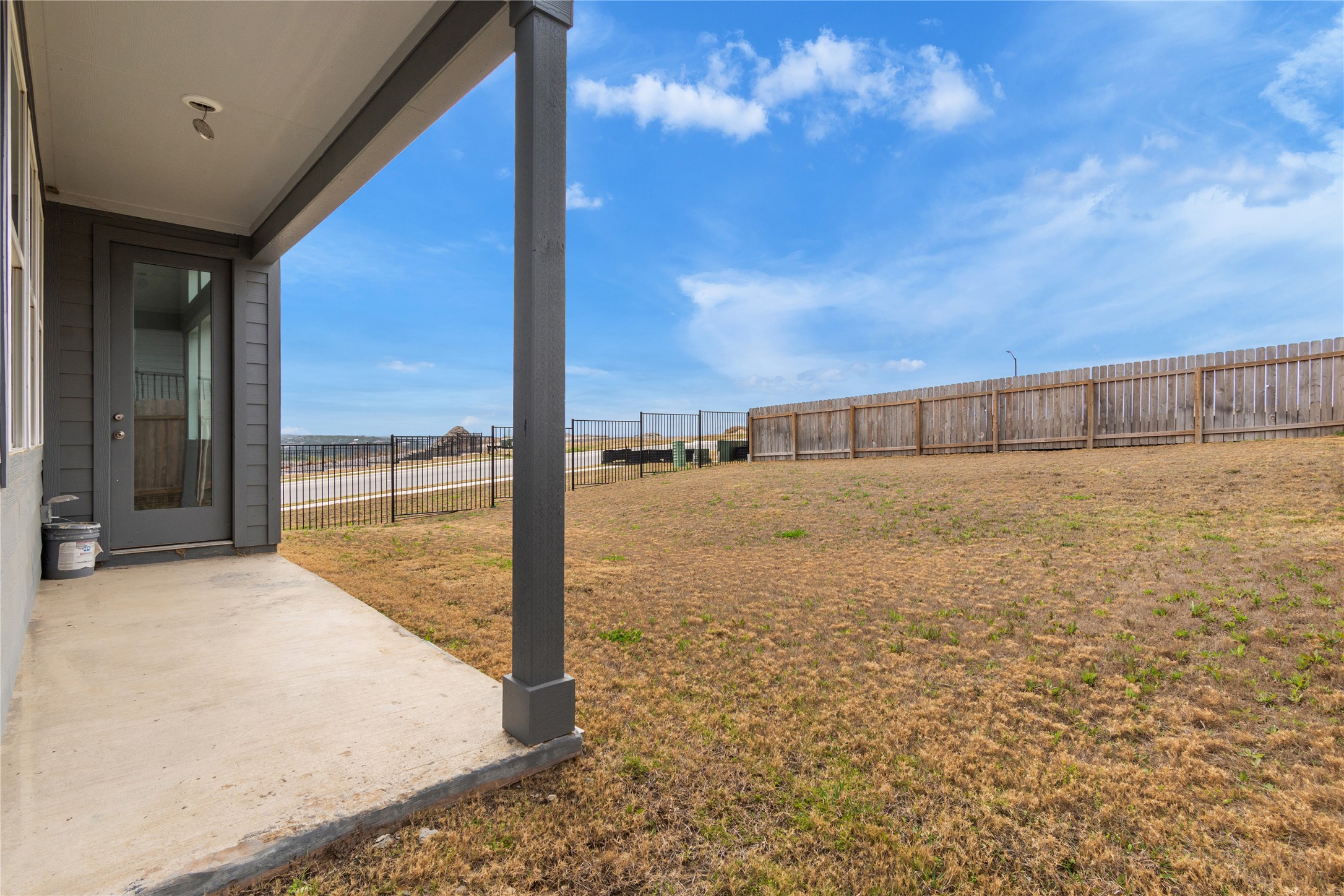 8500 Red Bottle Brush Road Lago Vista, TX 78645 - Photo 29 of 33 A spacious backyard with privacy fencing, perfect for outdoor activities or future landscaping projects.