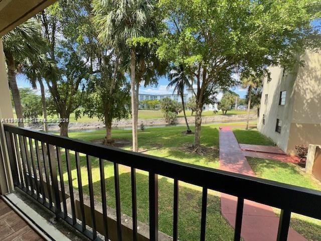 10845 Southwest 112th Avenue, Unit 211 Miami, FL 33176 - Photo 12 of 12 a view of green field with trees in the background