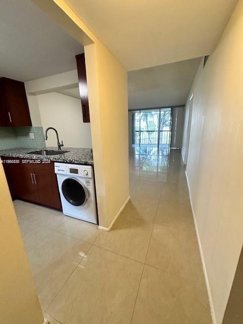 10845 Southwest 112th Avenue, Unit 211 Miami, FL 33176 - Photo 4 of 12 a kitchen with a stove top oven and cabinets