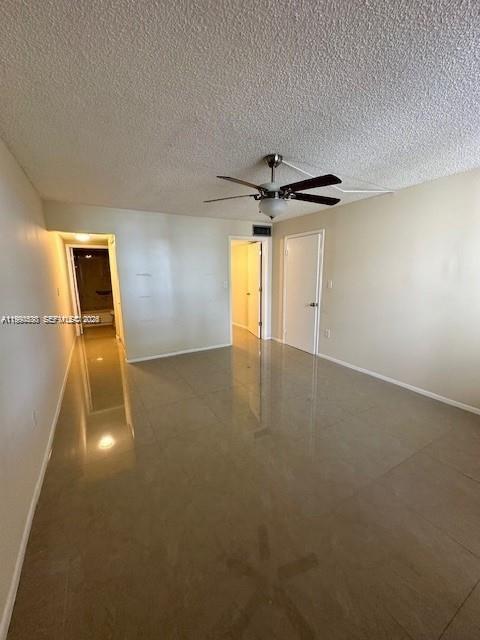 10845 Southwest 112th Avenue, Unit 211 Miami, FL 33176 - Photo 8 of 12 a view of a livingroom with a ceiling fan