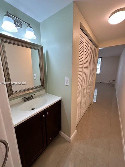 10845 Southwest 112th Avenue, Unit 211 Miami, FL 33176 - Photo 9 of 12 a bathroom with a sink vanity and mirror