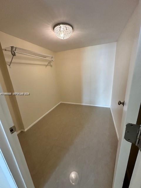 10845 Southwest 112th Avenue, Unit 211 Miami, FL 33176 - Photo 10 of 12 view of a room with rack on the wall
