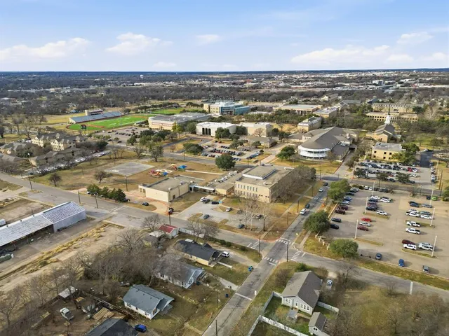 an aerial view of residential building with parking space