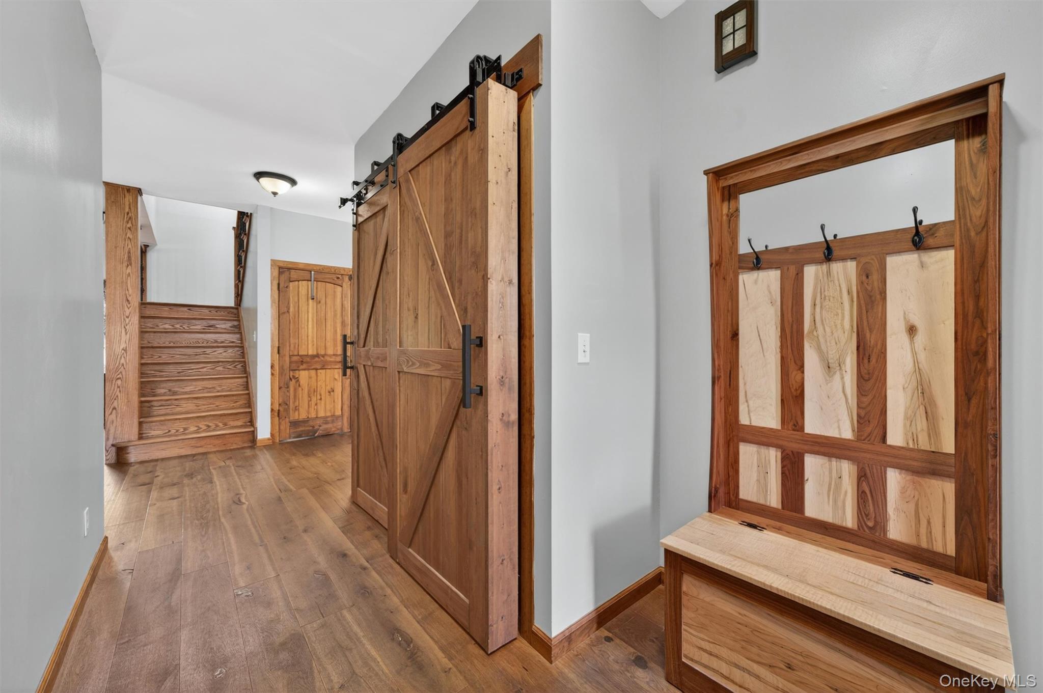 2 White Horse Road Middletown, NY 10940 - Photo 7 of 47 The entryway provides a warm haven from the elements and features an oversized coat closet tucked behind stylish, rustic barn doors.