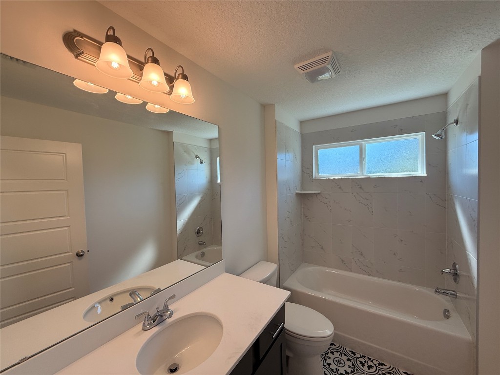 96076 Pirates Bluff Road Yulee, FL 32097 - Photo 16 of 22 a bathroom with a sink a toilet and bathtub