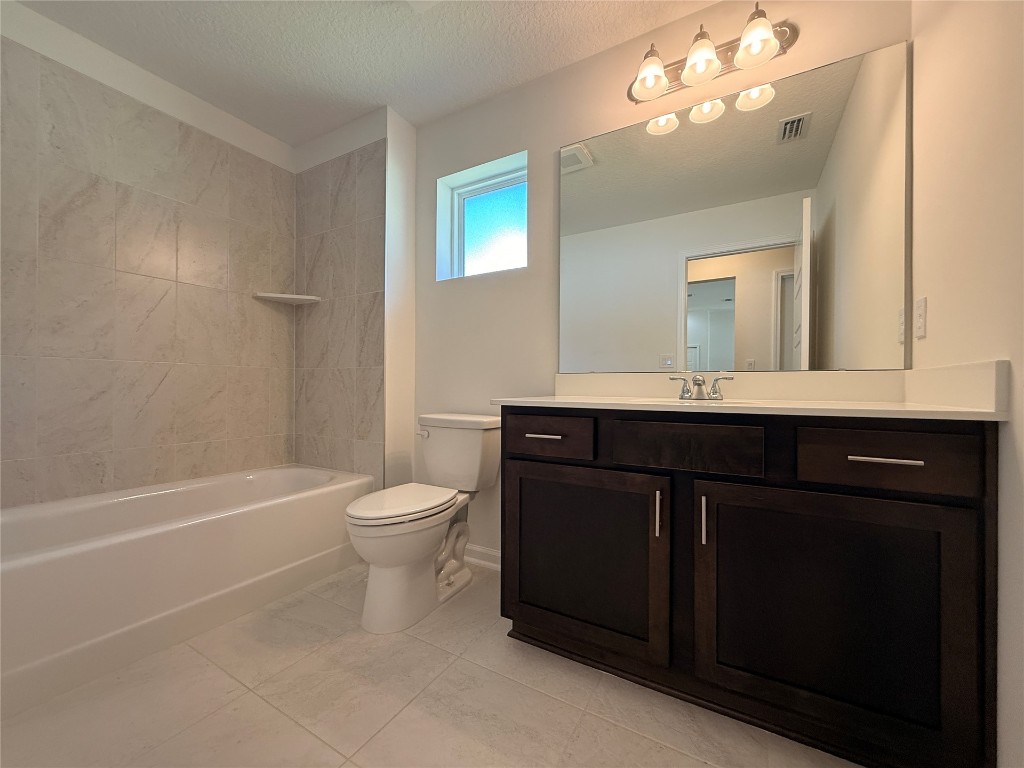 96076 Pirates Bluff Road Yulee, FL 32097 - Photo 17 of 22 a bathroom with a sink a toilet and a mirror