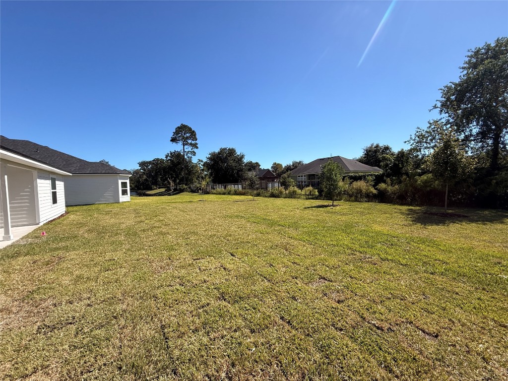 96076 Pirates Bluff Road Yulee, FL 32097 - Photo 20 of 22 a view of outdoor space and yard