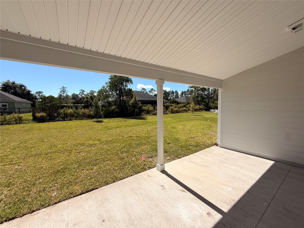 96076 Pirates Bluff Road Yulee, FL 32097 - Photo 21 of 22 a view of a swimming pool and an outdoor seating