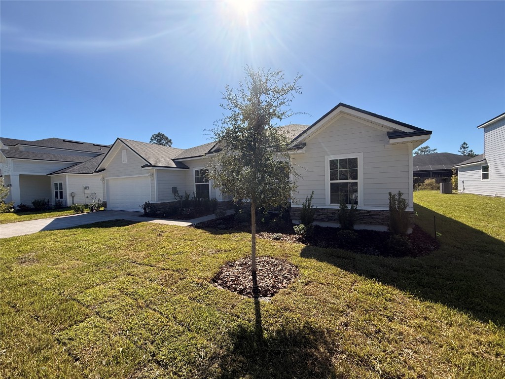 96076 Pirates Bluff Road Yulee, FL 32097 - Photo 3 of 22 a house view with a outdoor space