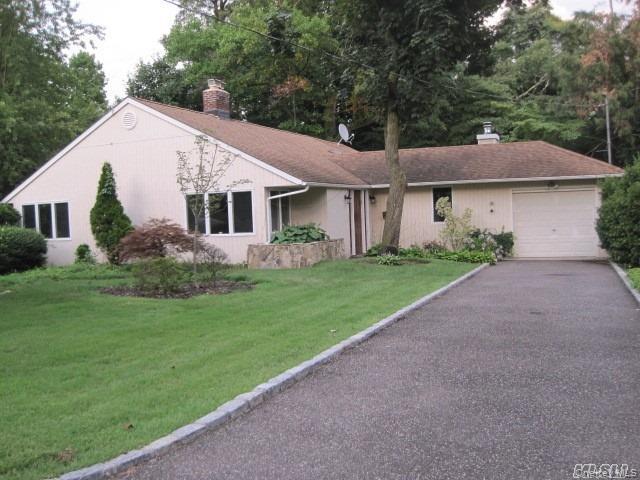 26 Ridge Drive East Roslyn, NY 11576 - Photo 1 of 28 a view of a house with a yard and potted plants
