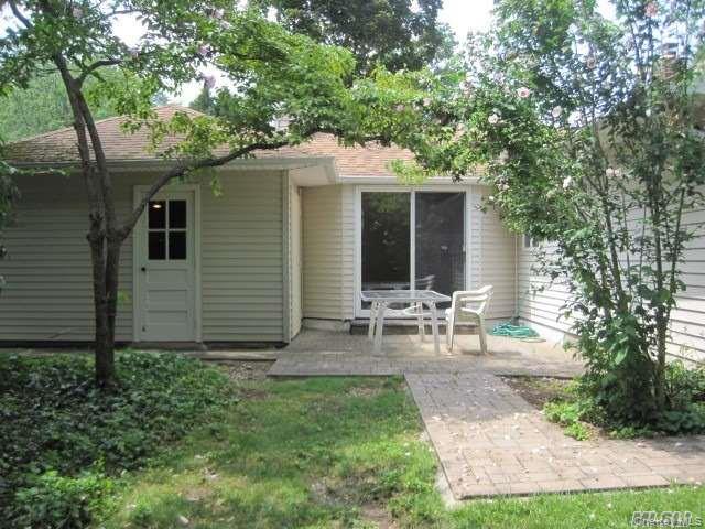 26 Ridge Drive East Roslyn, NY 11576 - Photo 26 of 28 a view of backyard of house with outdoor seating and green space