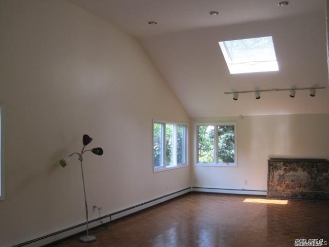 26 Ridge Drive East Roslyn, NY 11576 - Photo 6 of 28 a view of an empty room with a window