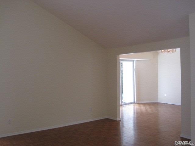 26 Ridge Drive East Roslyn, NY 11576 - Photo 9 of 28 a view of an empty room and wooden floor