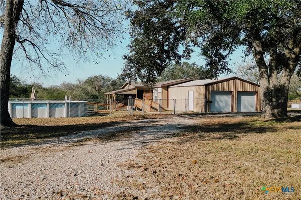 a house with trees in the background