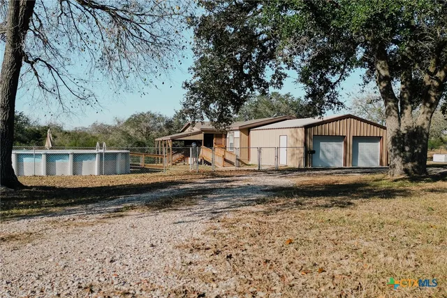 a house with trees in the background