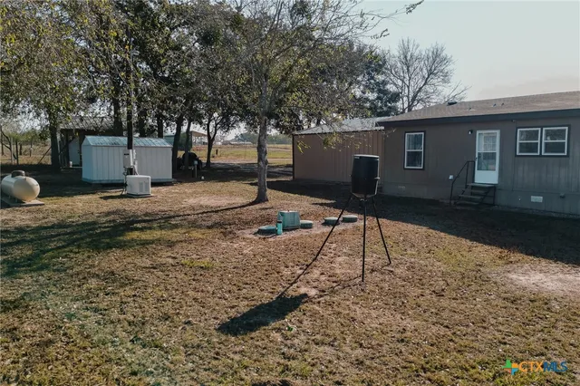 a house view with a backyard space