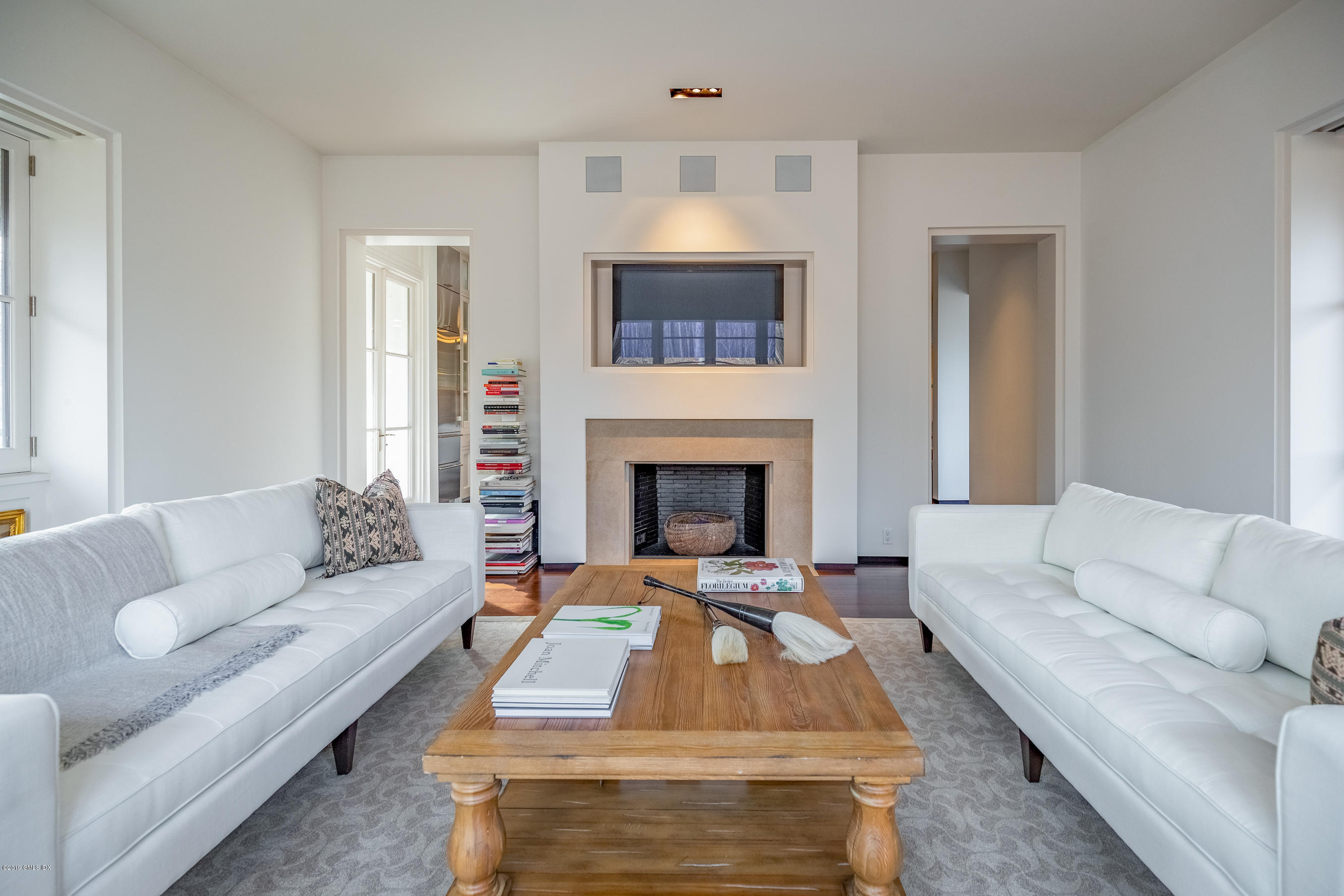 373 Riverbank Road Stamford, CT 06903 - Photo 11 of 35 a living room with furniture and a fireplace
